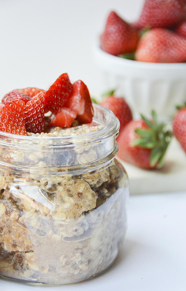 Cinnamon Raisin Overnight Oats topped with Strawberries