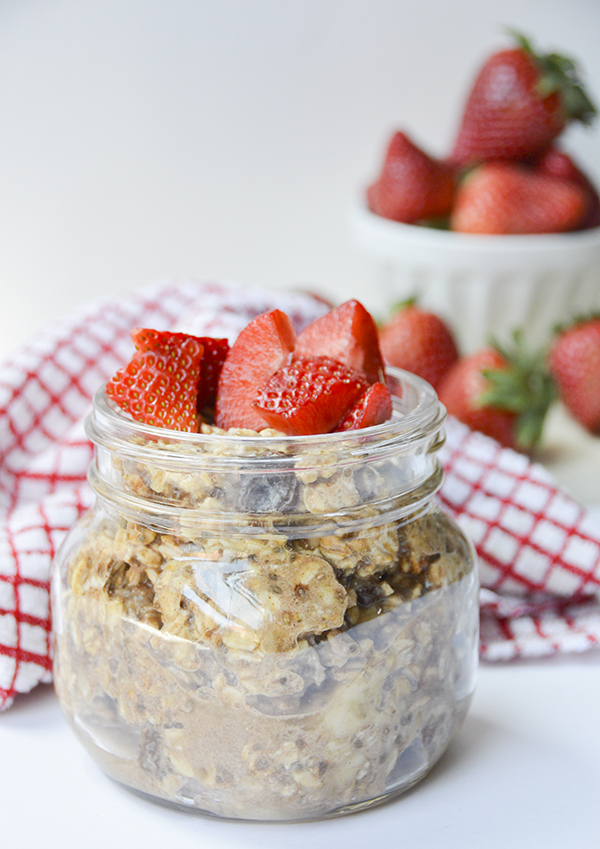 Cinnamon Raisin Overnight Oats topped with Strawberries