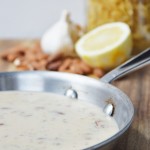 This creamy almond garlic sauce is dairy-free and delicious! Try it on pasta, zoodles, stir-fries and Buddha Bowls.