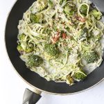 Zoodles and roasted broccoli in a creamy almond garlic sauce. This delicious recipe is dairy-free and perfect for your next Meatless Monday dinner.