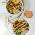 Vegan Burrito Bowls with Crispy Tofu & Chipotle Sauce - These yummy vegan burrito bowls are made with crispy baked tofu, corn & black bean salsa, and a dairy-free chipotle sauce. #veganrecipe #plantbasedrecipe #burritobowl #recipe